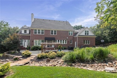 Welcome to this custom-built colonial home in the prestigious