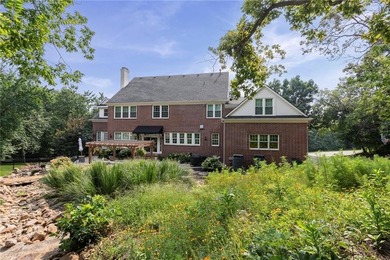 Welcome to this custom-built colonial home in the prestigious