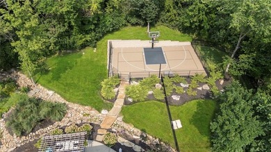 Welcome to this custom-built colonial home in the prestigious