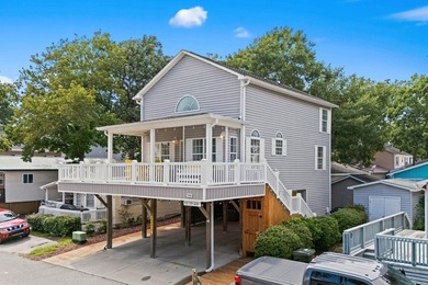 This spacious 3 Bedroom 2.5 Bath raised 1.5 story beach house is - photo 1