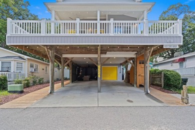 This spacious 3 Bedroom 2.5 Bath raised 1.5 story beach house is - photo 2