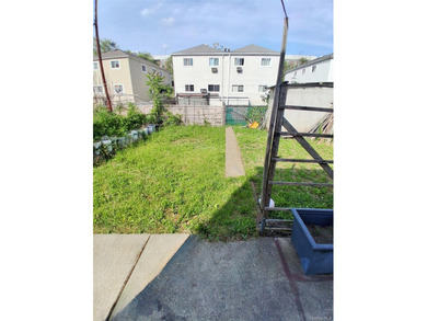 This two-bedroom, one-bathroom home in East Bronx sits within - photo 4