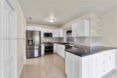 Welcome to this beautifully updated waterfront pool home in the - photo 3