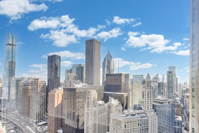 GREAT VIEWS, REDONE WOOD FLOORS, REMODELED KITCHEN, AND A HIGHLY