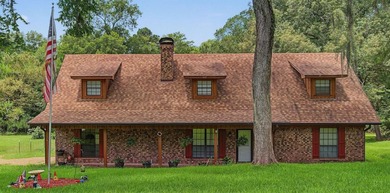 Tucked away on 1.21 acres along the canal side of beautiful Lake - photo 1
