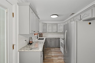 Tucked away on 1.21 acres along the canal side of beautiful Lake - photo 9