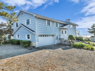 Start your summer 2026 in this prime bay front bi-level nestled - photo 2