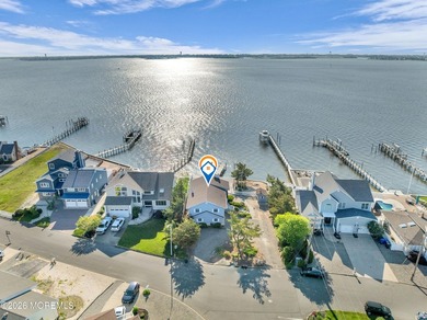 Start your summer 2026 in this prime bay front bi-level nestled - photo 7