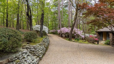 Private drive off a gated road leads to this home tucked among - photo 47