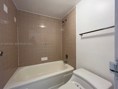 2/2 GROUND FLOOR UNIT WITH SPACIOUS FLOOR PLAN, ALL TILE FLOORS - photo 11