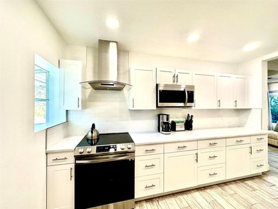 This substantially remodeled corner lot home in the serene - photo 6