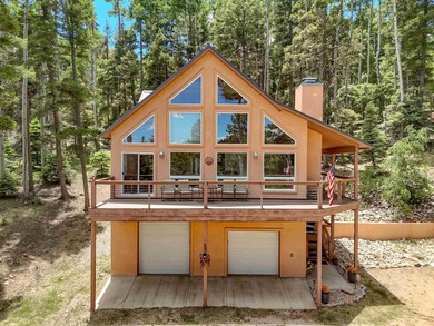 Nestled among the tall pines of Angel Fire, this warm and - photo 2