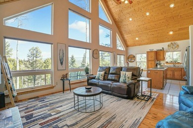Nestled among the tall pines of Angel Fire, this warm and - photo 6