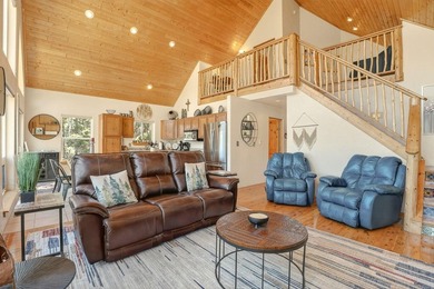 Nestled among the tall pines of Angel Fire, this warm and - photo 8