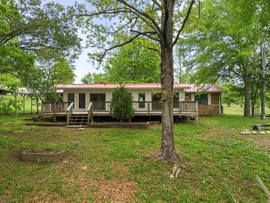 Tucked away in the natural beauty of Royal, Arkansas, this warm - photo 3