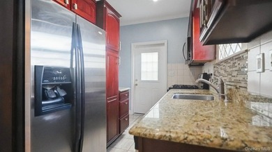 Welcome to this beautifully maintained two-family home in the - photo 5