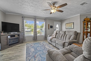 Three-bedroom, two-bathroom, single-story manufactured home with - photo 2