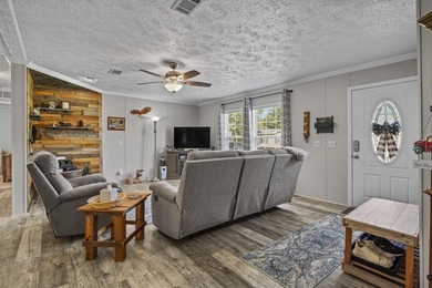 Three-bedroom, two-bathroom, single-story manufactured home with - photo 5