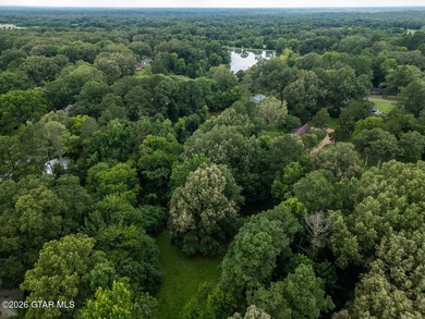 Set on 4.04 acres with pond frontage, this custom-built - photo 11