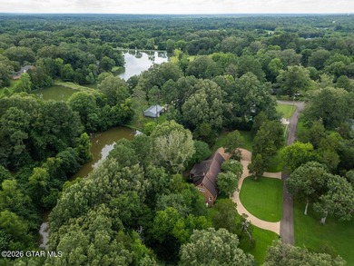 Set on 4.04 acres with pond frontage, this custom-built - photo 12