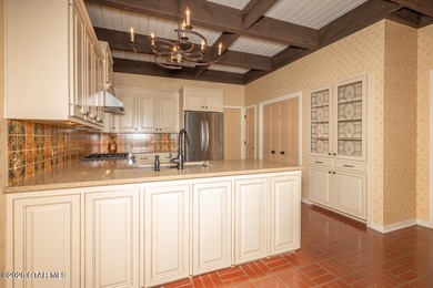 Set on 4.04 acres with pond frontage, this custom-built - photo 23