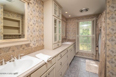 Set on 4.04 acres with pond frontage, this custom-built - photo 28