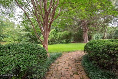 Set on 4.04 acres with pond frontage, this custom-built - photo 45