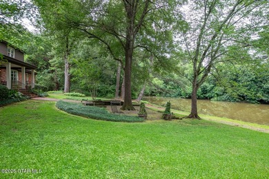 Set on 4.04 acres with pond frontage, this custom-built - photo 47