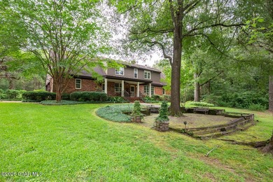 Set on 4.04 acres with pond frontage, this custom-built - photo 48