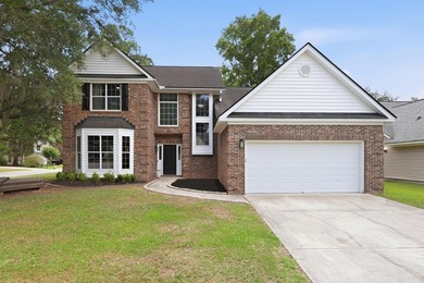 Perfectly positioned on a beautiful corner lot in the highly - photo 1