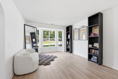 Perfectly positioned on a beautiful corner lot in the highly - photo 4