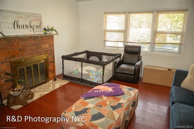 This 6 bedroom, 3-bathroom home features a cozy wood-burning - photo 4