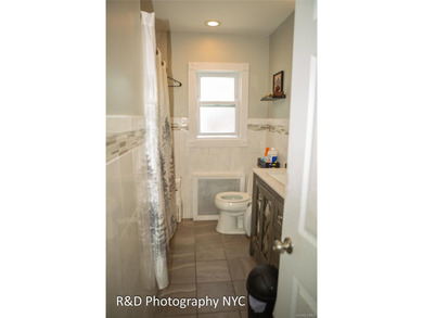 This 6 bedroom, 3-bathroom home features a cozy wood-burning - photo 10