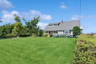 Nestled along picturesque Oregon Road, one of Cutchogue's most - photo 2