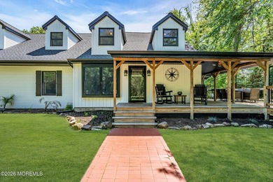 Tucked away on over an acre of private land, this beautifully - photo 1