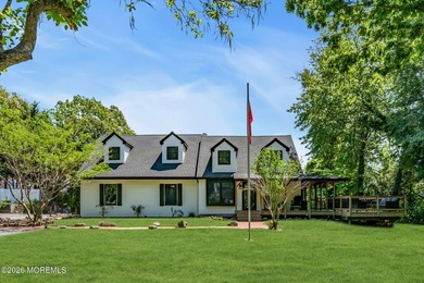 Tucked away on over an acre of private land, this beautifully - photo 2