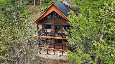 An exceptional opportunity to own a custom Jubach log cabin on - photo 4