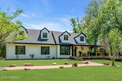 Tucked away on over an acre of private land, this beautifully - photo 5