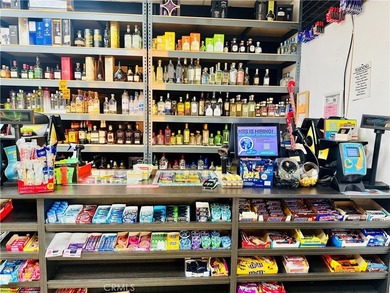 PRICE IMPROVEMENT! RECENTLY UPDATED LIQUOR STORE, IN A VERY BUSY - photo 2