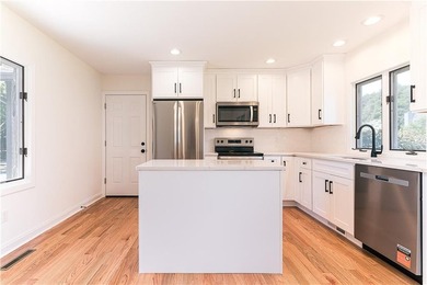 A rare find! Welcome to this sought-after one level end unit in - photo 6