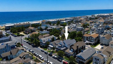Just steps from the sand and surf, this exceptional oceanblock - photo 3