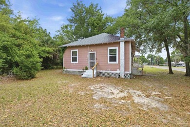 Situated on a corner lot and adorned with majestic oak trees - photo 31