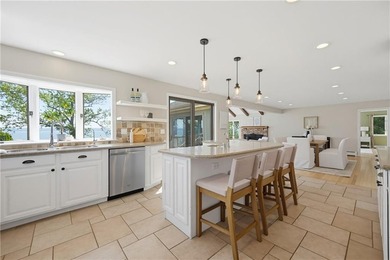 Tucked away on a quiet cul-de-sac, this exceptional waterfront - photo 9