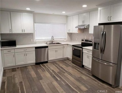 Experience refined coastal living in this elegantly updated - photo 1
