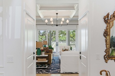 This elevated waterfront home with a private dock has been - photo 9