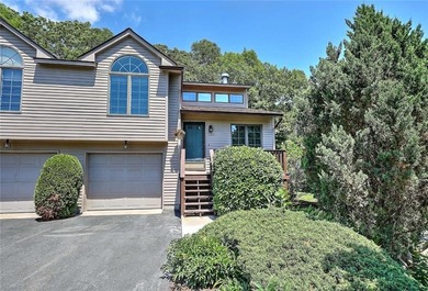 This well-maintained townhouse-style condominium is located in - photo 2