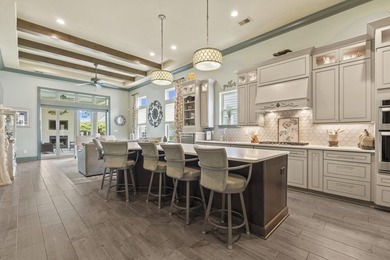 Welcome to 5972 Bolsena Place, an exceptional custom-built - photo 10