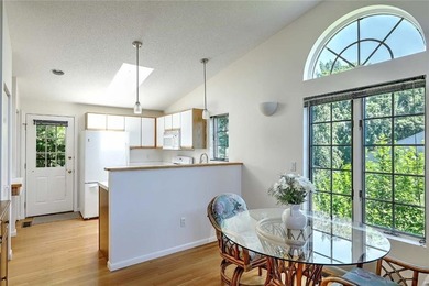 This well-maintained townhouse-style condominium is located in - photo 10