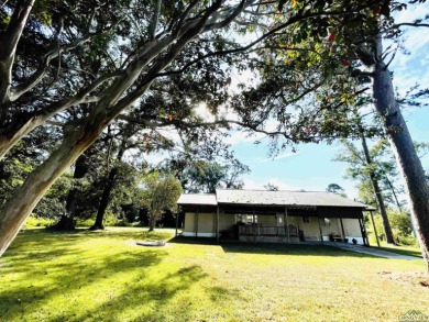 This well maintained home located on Lake Murvaul sits on a lot - Lake Home For Sale in Carthage, Texas