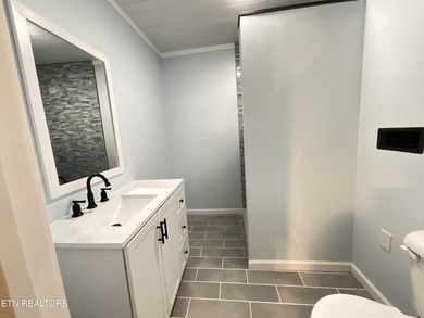 Modern City Living Near the Lake! 3 BR | 2 BA | Fully Updated - photo 14